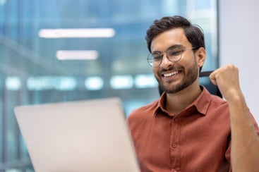 happy-young-professional-celebrating-success-on-la-2025-03-25-13-44-56-utc-1024x683