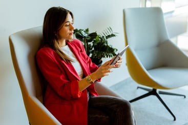 young-professional-woman-working-on-tablet-in-mode-2025-02-21-17-57-39-utc-1024x683