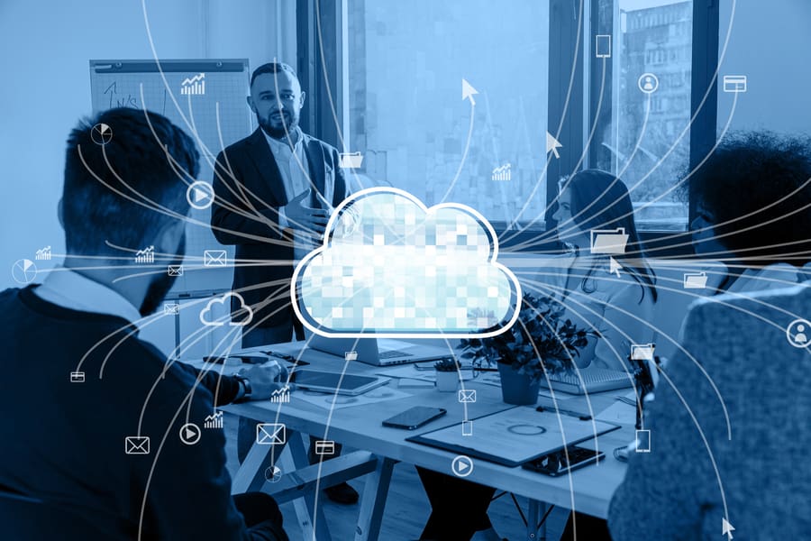 IT professionals optimising cloud solutions for manufacturing systems.